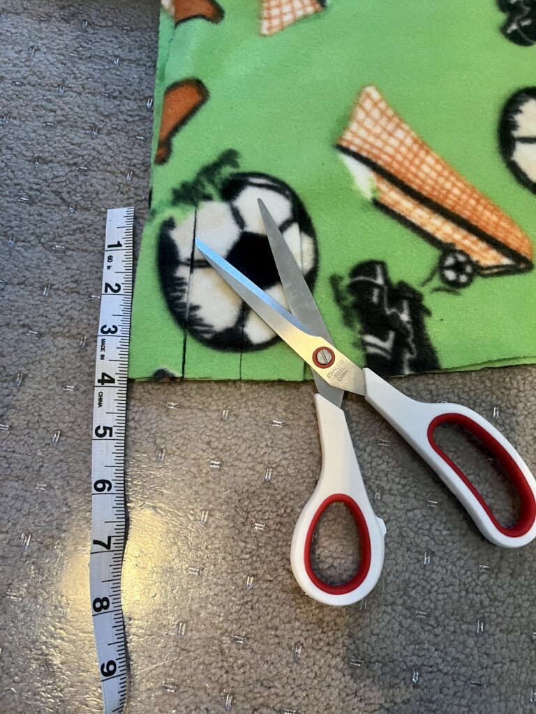 Fabric with scissors and measuring tape