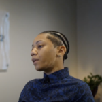 woman sitting and talking to camera