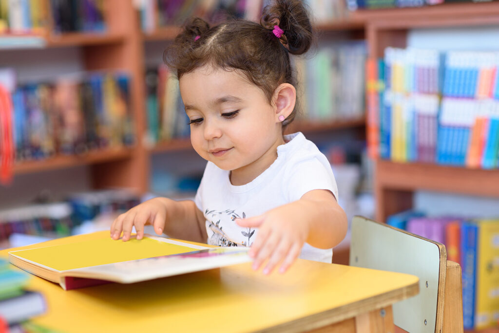 Enriching Early Childhood Education: A Fresh Start. Toddler Girl at learning table