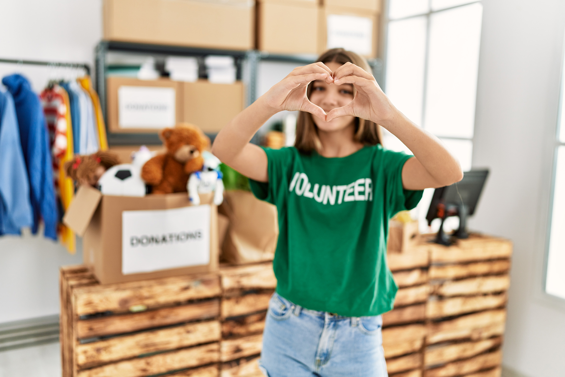 Next Gen teen girl volunteering at donation drive. 